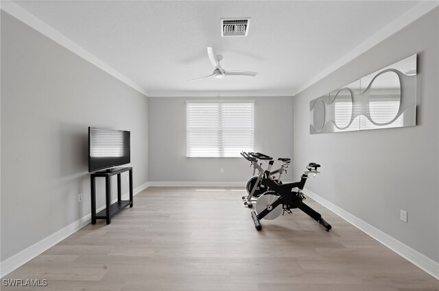 4654 Kensington Cir, Naples, FL 34119 - workout area with a ceiling fan, crown molding, light wood-style floors, and baseboards