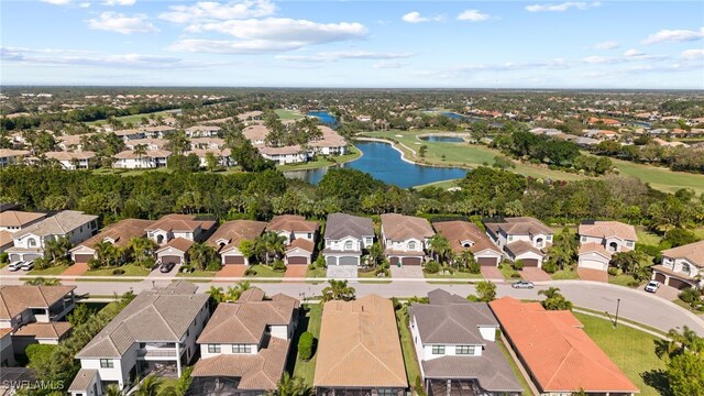 4654 Kensington Cir, Naples, FL 34119 - aerial overview of property's location with nearby suburban area, a large body of water, and a golf course
