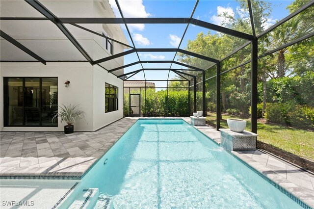 4654 Kensington Cir, Naples, FL 34119 - outdoor pool with a patio area and glass enclosure