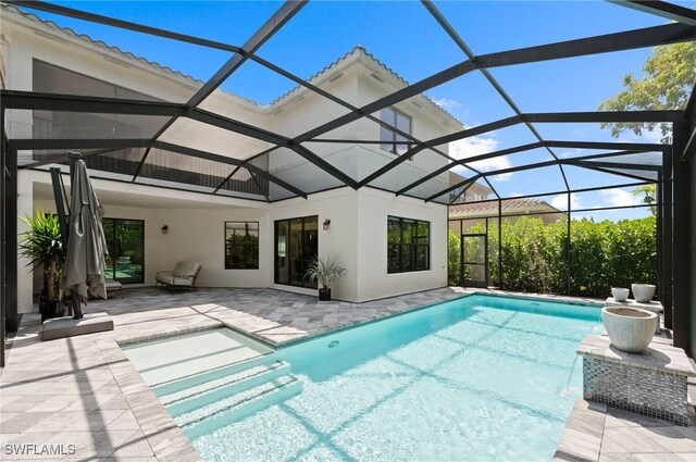 4654 Kensington Cir, Naples, FL 34119 - outdoor pool with a patio and a lanai