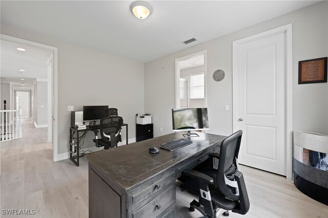 4654 Kensington Cir, Naples, FL 34119 - home office with light wood-type flooring and baseboards