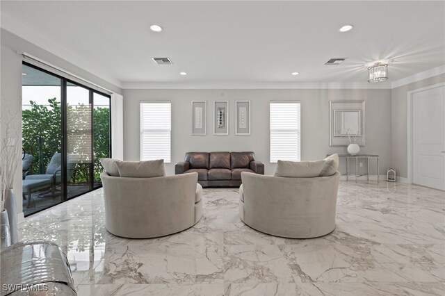 4654 Kensington Cir, Naples, FL 34119 - living area with healthy amount of natural light, recessed lighting, crown molding, and marble tiled floors