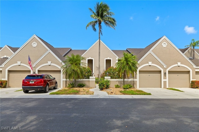 16290 Kelly Cove Dr Unit 253, Fort Myers, FL 33908 - view of front of home with driveway, stucco siding, and an attached garage