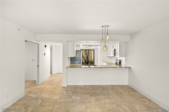 16290 Kelly Cove Dr Unit 253, Fort Myers, FL 33908 - kitchen featuring stainless steel appliances, stone countertops, white cabinets, baseboards, and decorative backsplash