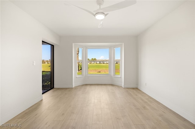 16290 Kelly Cove Dr Unit 253, Fort Myers, FL 33908 - spare room with light wood-style flooring, a ceiling fan, and baseboards