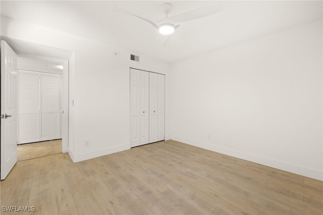 16290 Kelly Cove Dr Unit 253, Fort Myers, FL 33908 - unfurnished bedroom with light wood-style floors, baseboards, a closet, and ceiling fan