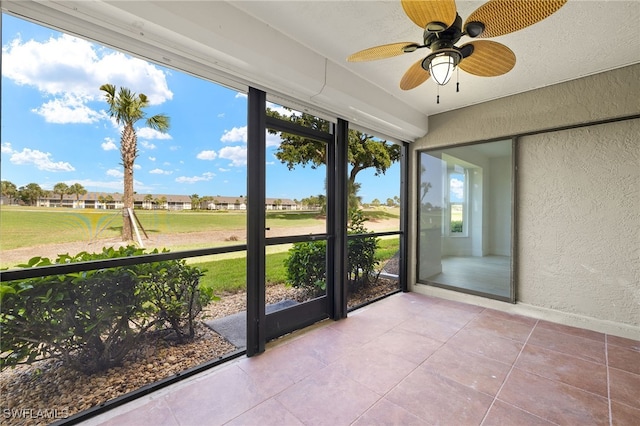 16290 Kelly Cove Dr Unit 253, Fort Myers, FL 33908 - unfurnished sunroom with plenty of natural light and ceiling fan