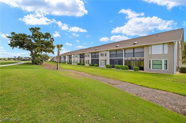 16290 Kelly Cove Dr Unit 253, Fort Myers, FL 33908 - view of home's community with a lawn