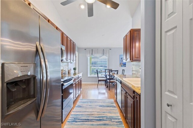 608 SW 43rd Ter, Cape Coral, FL 33914 - kitchen featuring stainless steel appliances, ceiling fan, light countertops, light wood-style flooring, and decorative backsplash