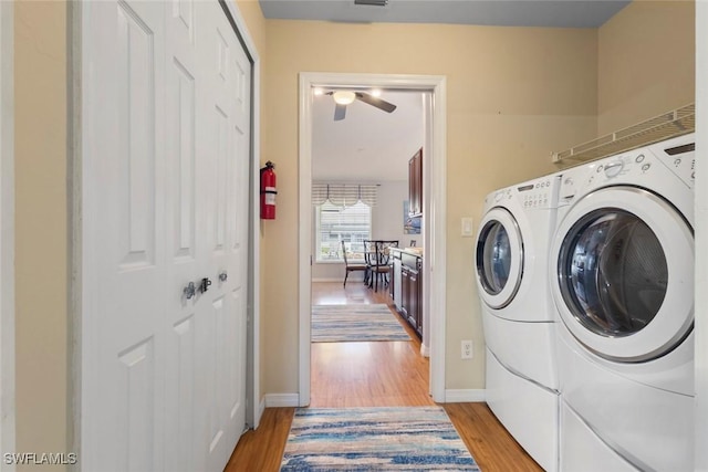 608 SW 43rd Ter, Cape Coral, FL 33914 - washroom featuring washer and dryer, light wood finished floors, and ceiling fan