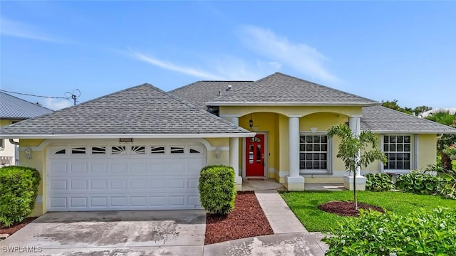 608 SW 43rd Ter, Cape Coral, FL 33914 - view of front of property featuring a shingled roof, stucco siding, a garage, and driveway