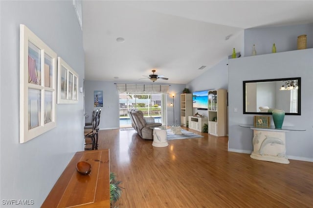 608 SW 43rd Ter, Cape Coral, FL 33914 - living room with vaulted ceiling, wood finished floors, and ceiling fan