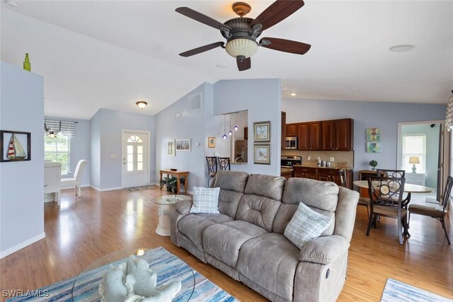 608 SW 43rd Ter, Cape Coral, FL 33914 - living area with vaulted ceiling, light wood-type flooring, and ceiling fan