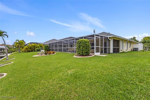 608 SW 43rd Ter, Cape Coral, FL 33914 - view of green lawn with glass enclosure