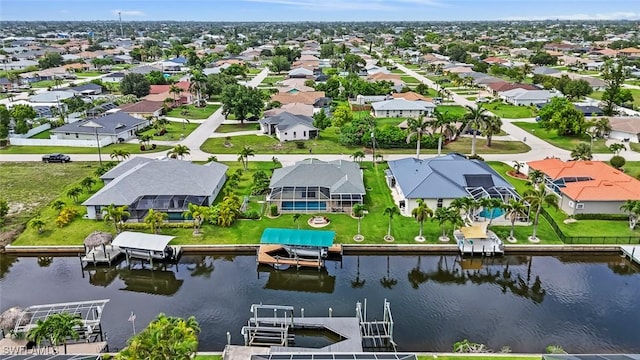608 SW 43rd Ter, Cape Coral, FL 33914 - aerial perspective of suburban area with a nearby body of water