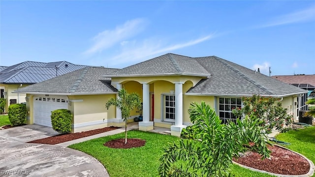 608 SW 43rd Ter, Cape Coral, FL 33914 - view of front of property featuring stucco siding, a garage, roof with shingles, and a front yard