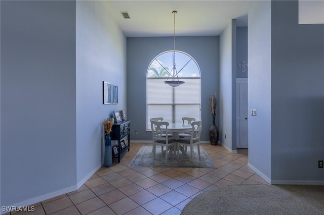 19372 Silver Oak Dr, Estero, FL 33967 - dining space featuring plenty of natural light, light tile patterned flooring, and a chandelier