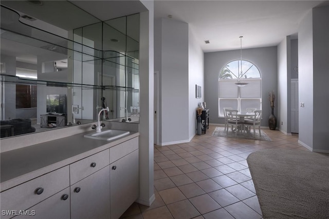 19372 Silver Oak Dr, Estero, FL 33967 - bar area featuring a sink, tile patterned floors, baseboards, and a chandelier