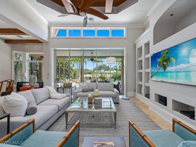 14822 Bellezza Ln, Naples, FL 34110 - living room with a ceiling fan, built in features, ornamental molding, baseboards, and a towering ceiling