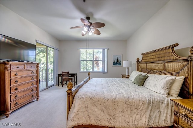 5912 Tarpon Gardens Cir Unit 201, Cape Coral, FL 33914 - bedroom featuring light carpet, access to outside, and a ceiling fan