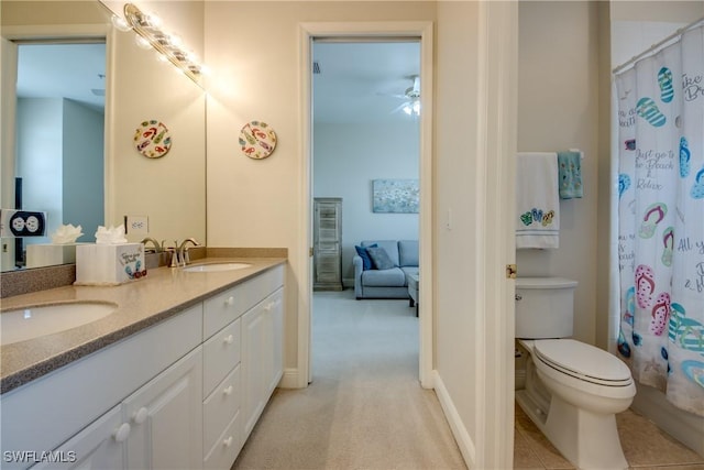 5912 Tarpon Gardens Cir Unit 201, Cape Coral, FL 33914 - bathroom featuring double vanity, a ceiling fan, toilet, and a shower with curtain