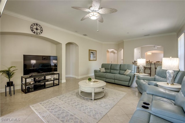 5912 Tarpon Gardens Cir Unit 201, Cape Coral, FL 33914 - living area featuring ceiling fan, arched walkways, light tile patterned floors, ornamental molding, and baseboards