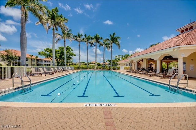 5912 Tarpon Gardens Cir Unit 201, Cape Coral, FL 33914 - community pool featuring a patio area