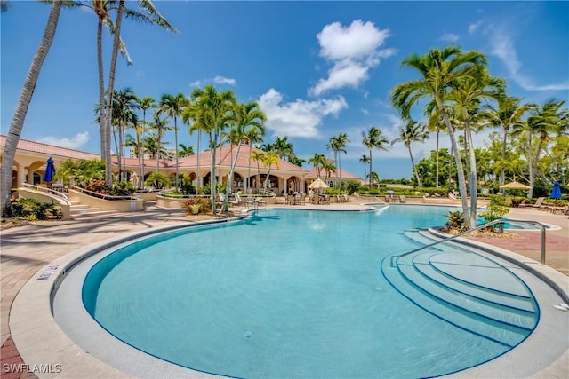 5912 Tarpon Gardens Cir Unit 201, Cape Coral, FL 33914 - community pool with a patio area
