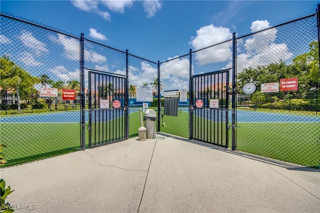 5912 Tarpon Gardens Cir Unit 201, Cape Coral, FL 33914 - view of basketball court with a gate