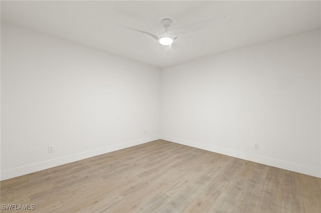 16410 Kelly Cove Dr Unit 313, Fort Myers, FL 33908 - unfurnished room with baseboards, a ceiling fan, and light wood-type flooring