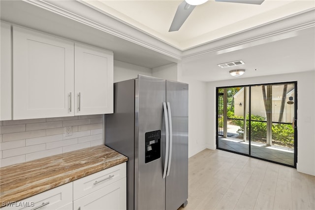 16410 Kelly Cove Dr Unit 313, Fort Myers, FL 33908 - kitchen with stainless steel fridge with ice dispenser, tasteful backsplash, white cabinets, light wood-type flooring, and light stone countertops