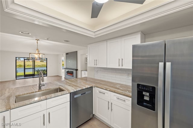 16410 Kelly Cove Dr Unit 313, Fort Myers, FL 33908 - kitchen featuring stainless steel appliances, a sink, tasteful backsplash, light stone countertops, and recessed lighting
