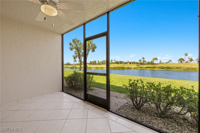 16410 Kelly Cove Dr Unit 313, Fort Myers, FL 33908 - unfurnished sunroom with a ceiling fan and a water view
