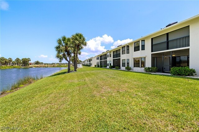 16410 Kelly Cove Dr Unit 313, Fort Myers, FL 33908 - view of community with a water view and a yard