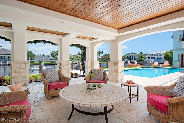 2001 4th St S, Naples, FL 34102 - view of patio / terrace with an outdoor pool and a residential view