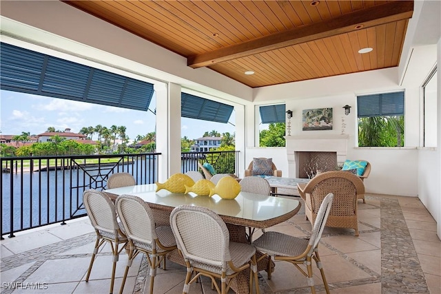 2001 4th St S, Naples, FL 34102 - view of patio with a fireplace and a water view