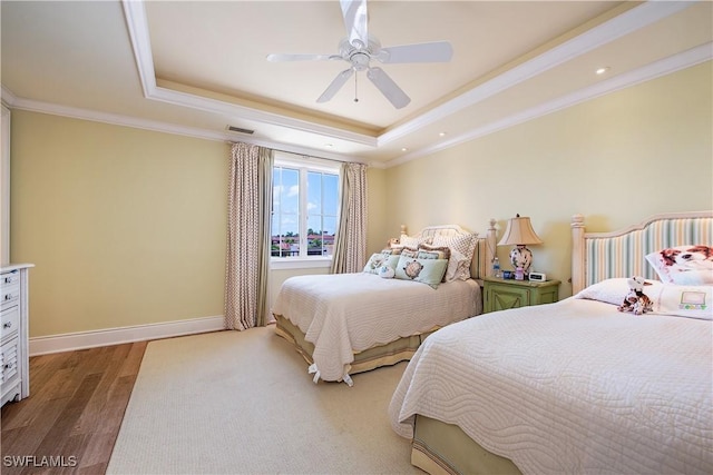 2001 4th St S, Naples, FL 34102 - bedroom with a raised ceiling, wood finished floors, ornamental molding, and a ceiling fan