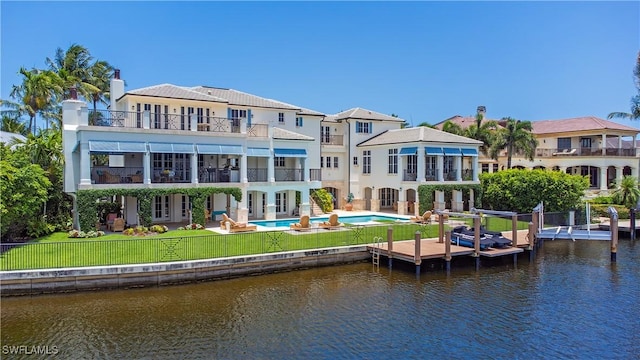 2001 4th St S, Naples, FL 34102 - back of property featuring a balcony, a patio area, an outdoor pool, and a water view