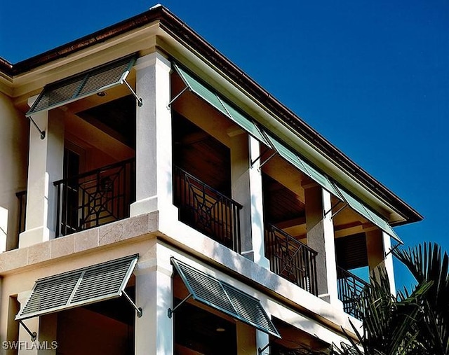 2001 4th St S, Naples, FL 34102 - view of home's exterior featuring stucco siding