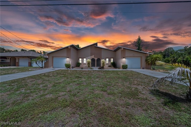 1237 SE 24th Ave Unit A, Cape Coral, FL 33990 - mid-century home featuring driveway, an attached garage, and stucco siding