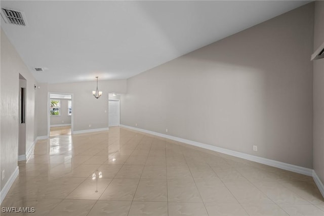 1237 SE 24th Ave Unit A, Cape Coral, FL 33990 - unfurnished room featuring lofted ceiling, a chandelier, baseboards, and light tile patterned floors