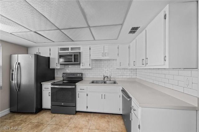 1237 SE 24th Ave Unit A, Cape Coral, FL 33990 - kitchen with stainless steel appliances, a sink, white cabinets, and light countertops