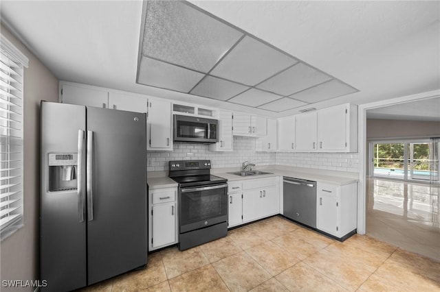 1237 SE 24th Ave Unit A, Cape Coral, FL 33990 - kitchen with stainless steel appliances, light countertops, a sink, tasteful backsplash, and white cabinetry
