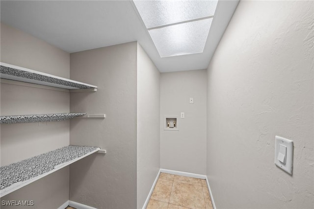 1237 SE 24th Ave Unit A, Cape Coral, FL 33990 - washroom with washer hookup, baseboards, light tile patterned floors, and a desk