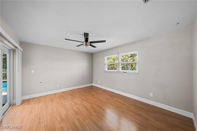 1237 SE 24th Ave Unit A, Cape Coral, FL 33990 - empty room with light wood finished floors, baseboards, and a ceiling fan