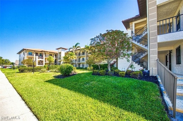 12581 Kelly Sands Way Unit 525, Fort Myers, FL 33908 - view of community featuring a yard and stairs