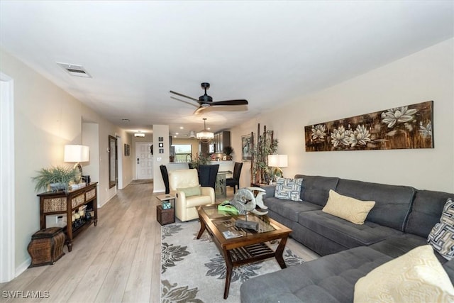 12581 Kelly Sands Way Unit 525, Fort Myers, FL 33908 - living area with ceiling fan, light wood finished floors, and baseboards