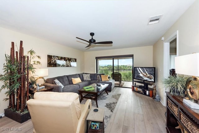 12581 Kelly Sands Way Unit 525, Fort Myers, FL 33908 - living room with light wood finished floors and ceiling fan