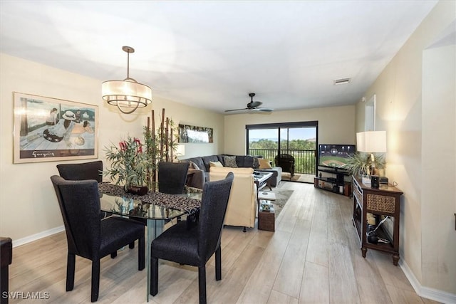 12581 Kelly Sands Way Unit 525, Fort Myers, FL 33908 - dining area featuring light wood-style floors, ceiling fan, and baseboards