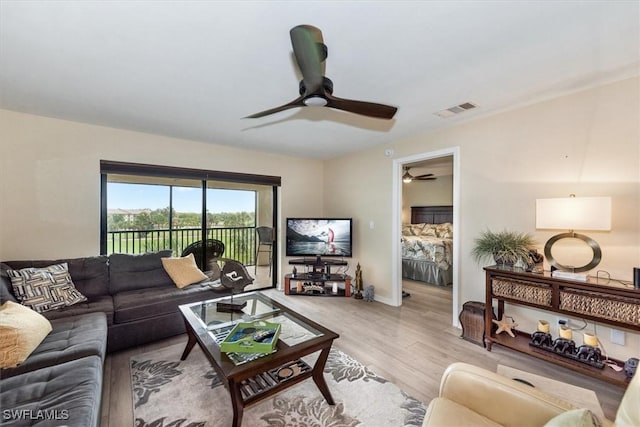 12581 Kelly Sands Way Unit 525, Fort Myers, FL 33908 - living area with ceiling fan, light wood-style flooring, and baseboards